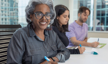 people sitting at meeting table